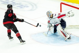 RALEIGH, NC - DECEMBER 14: Carolina Hurricanes left winger Phillip Di Giuseppe (7) misses wide against Washington Capitals goaltender Braden Holtby (70) during an overtime shootout on December 14, 2018, at PNC Arena in Raleigh, NC. (Photo by Jay Anderson/Icon Sportswire)