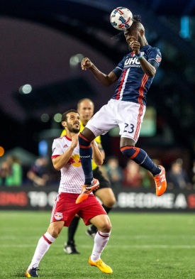 July 05, 2017; Foxborough, MA, USA; New England Revolution forward  Kei Kamara (23) heads the ball over New York Red Bulls midfielder Felipe Campanholi (8) during an MLS regular season match at Gillette Stadium. Photo credit: Jay Anderson - KLC fotos
