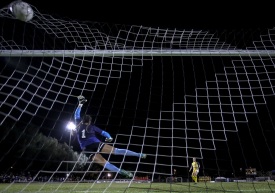 Nov. 03, 2016; Long Beach, CA; UC Irvine midfielder Grayson Galbraith (13) scores the final penalty kick shootout goal past Long Beach State goalkeeper  Jennifer Stuart (1) after double overtime during the Big West Conference tournament.Photo by: Jay Anderson / Sports Shooter Academy